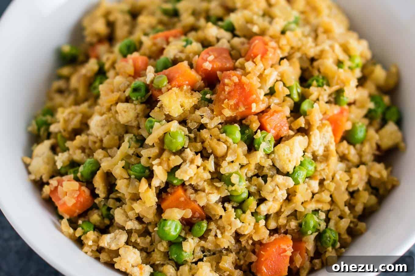 Flavorful Tofu and Cauliflower Rice Stir-Fry 10 This cauliflower tofu fried rice is vegan, gluten free, grain free, and low carb. You won't believe this doesn't have rice or eggs in it! My new favorite dinner recipe! #grainfree #glutenfree #cauliflowerfriedrice #tofufriedrice #vegan #dinner #eggfree