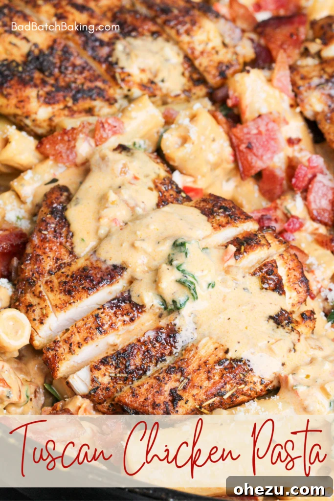 Tuscan Chicken Pasta served in a bowl with a fork