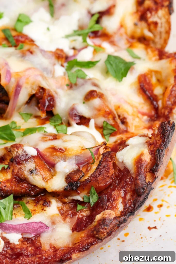 Signature BBQ Chicken French Bread Pizza 3 Another view of the BBQ Chicken French Bread Pizza, showing the perfectly melted cheese and generous toppings.