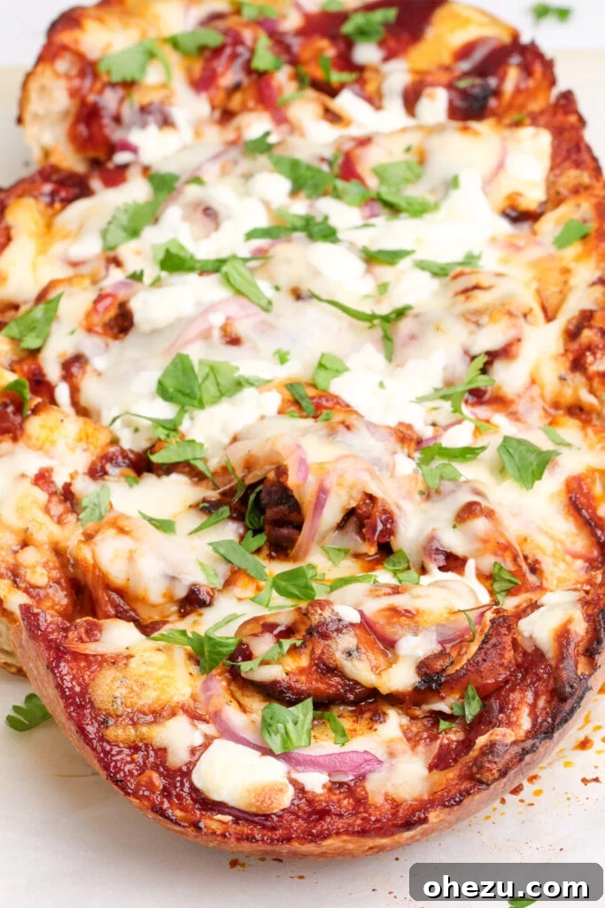 Signature BBQ Chicken French Bread Pizza 10 Final plated shot of BBQ Chicken French Bread Pizza, perfectly cut and garnished.