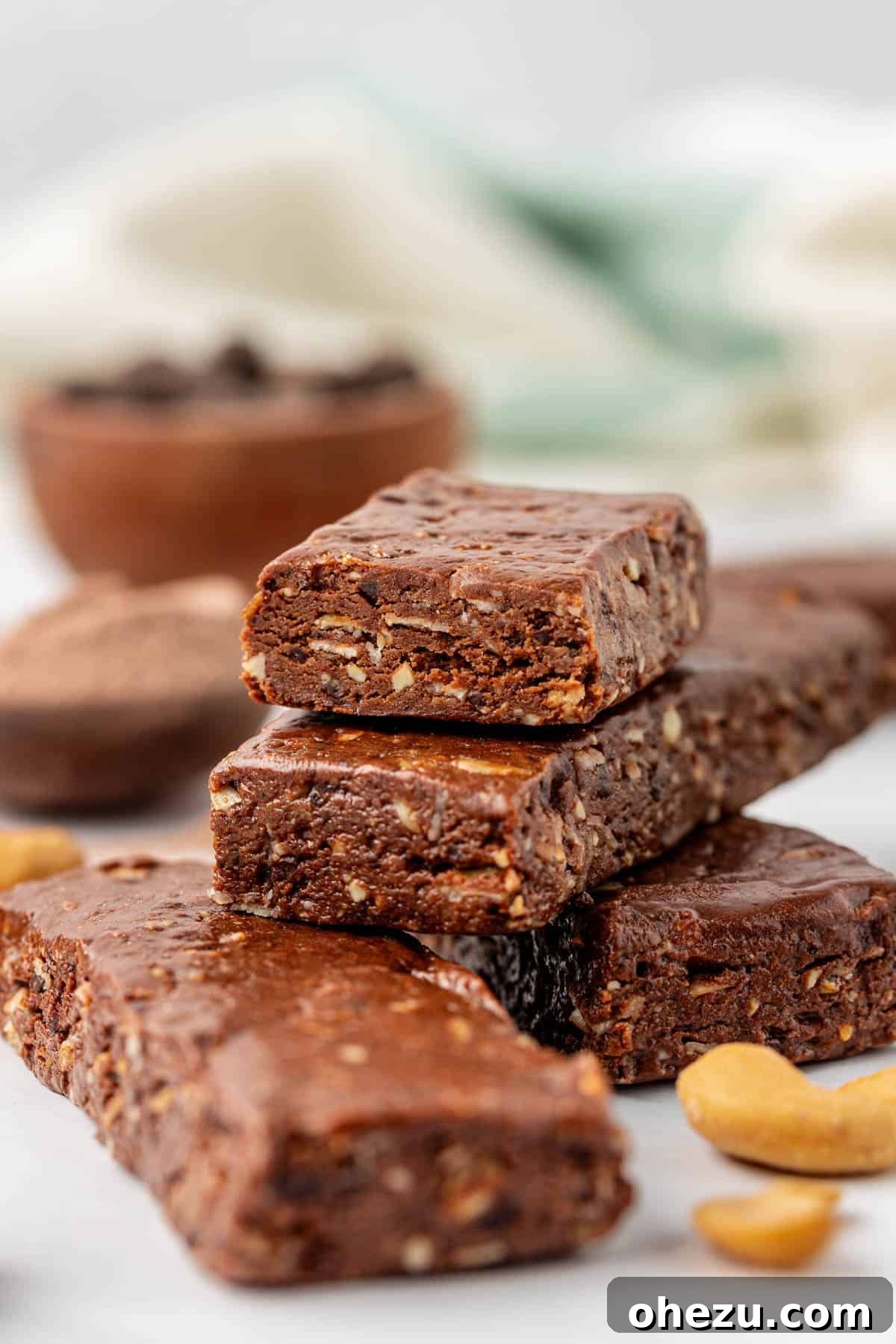 A stack of delicious no-bake chocolate protein bars on a rustic surface