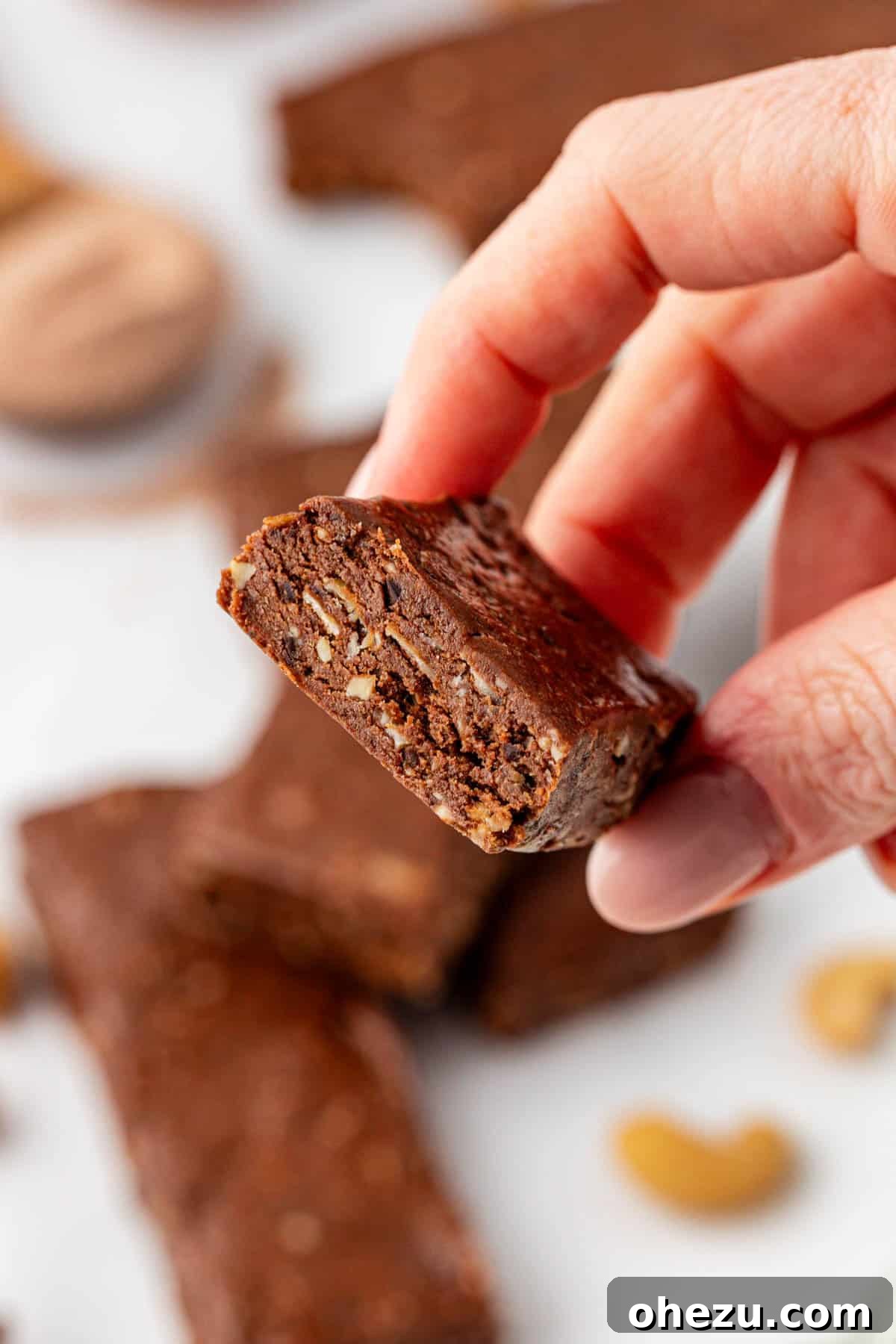 Various no-bake chocolate protein bars arranged aesthetically