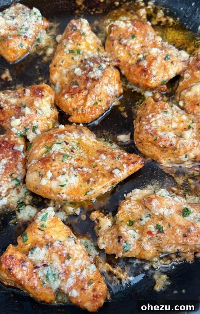 Irresistible Garlic Parmesan Chicken Sliders on Sweet Hawaiian Buns 5 Close-up of a Garlic Parmesan Chicken Slider being assembled