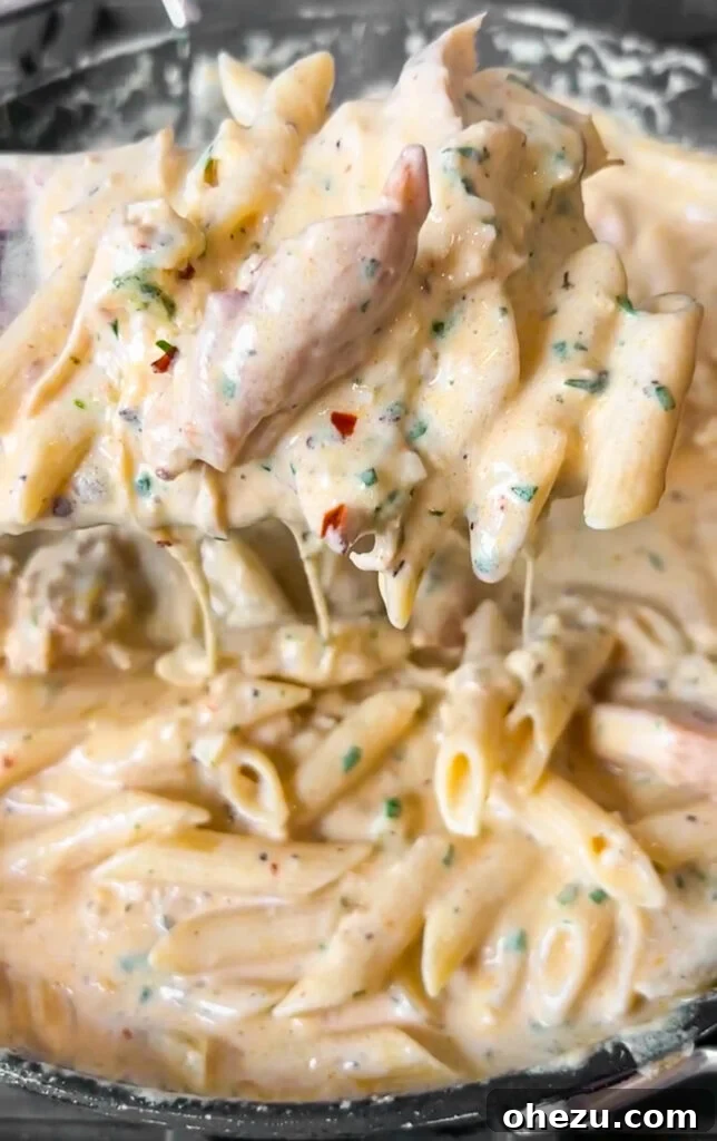 Creamy Garlic Parmesan Chicken Pasta 2 Creamy Garlic Parmesan Chicken Pasta in a skillet
