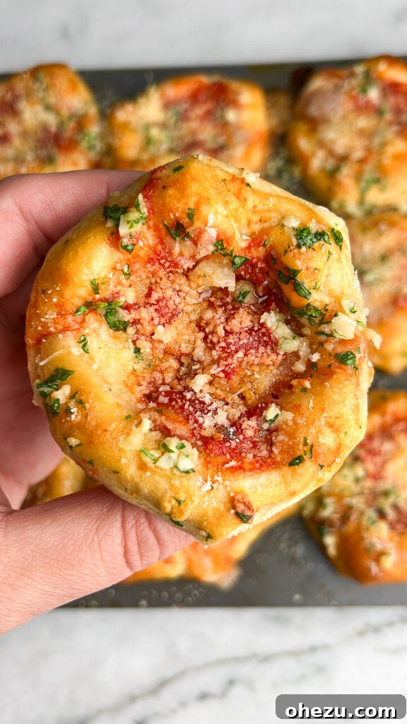 Another view of freshly baked Mini Deep Dish Pizzas in a muffin tin