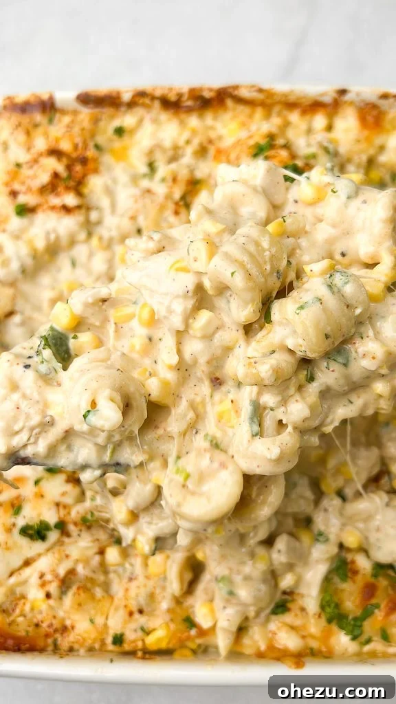Delicious baked Elote Mac and Cheese casserole with fresh herbs