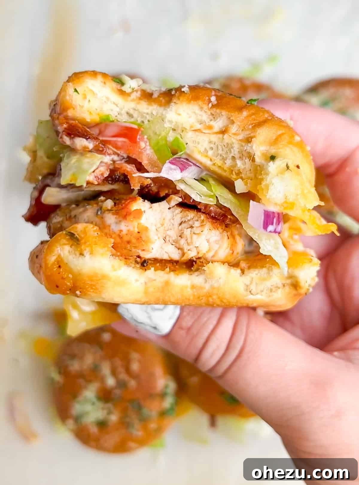 Close-up of Blackened Chicken Bacon Ranch Sliders with fresh ingredients