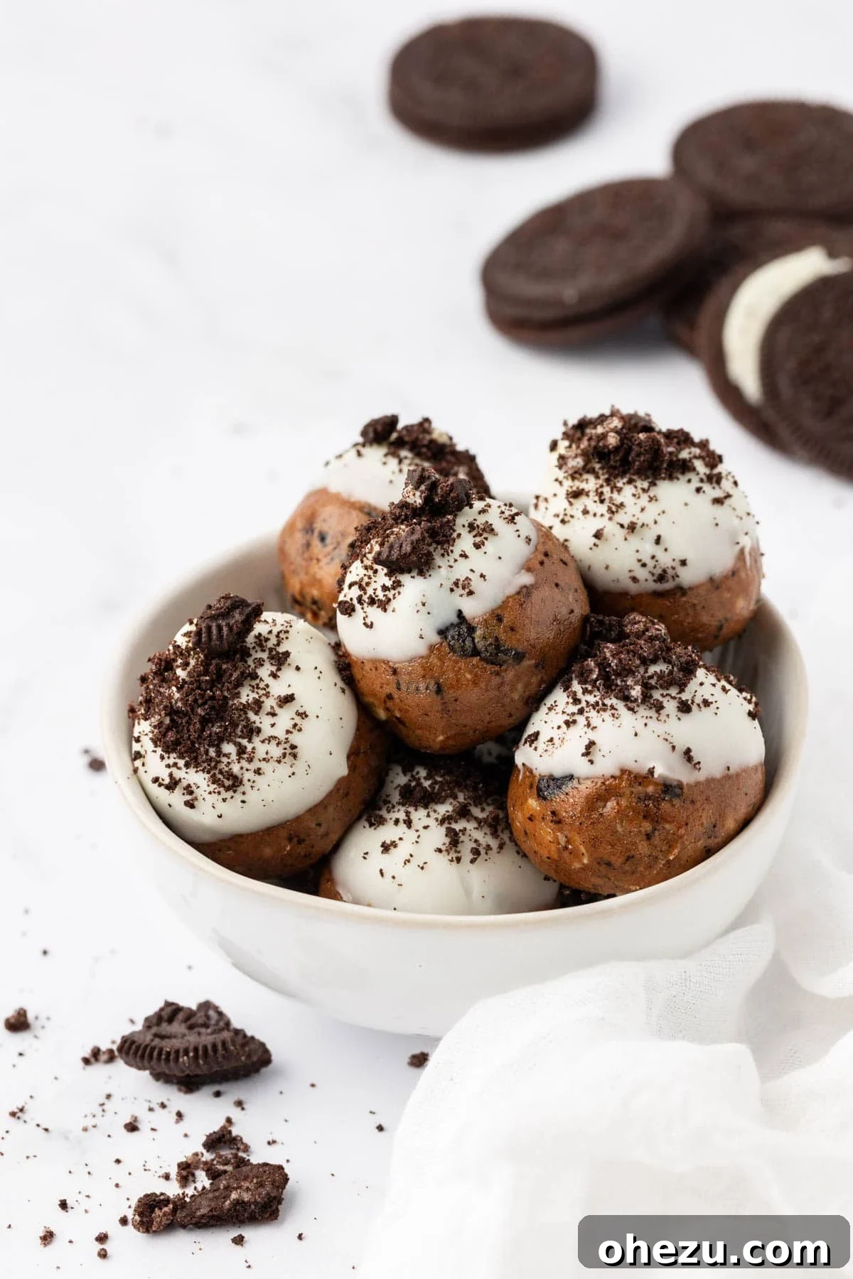 Delicious no-bake cookies and cream protein balls on a platter, ready to be enjoyed.