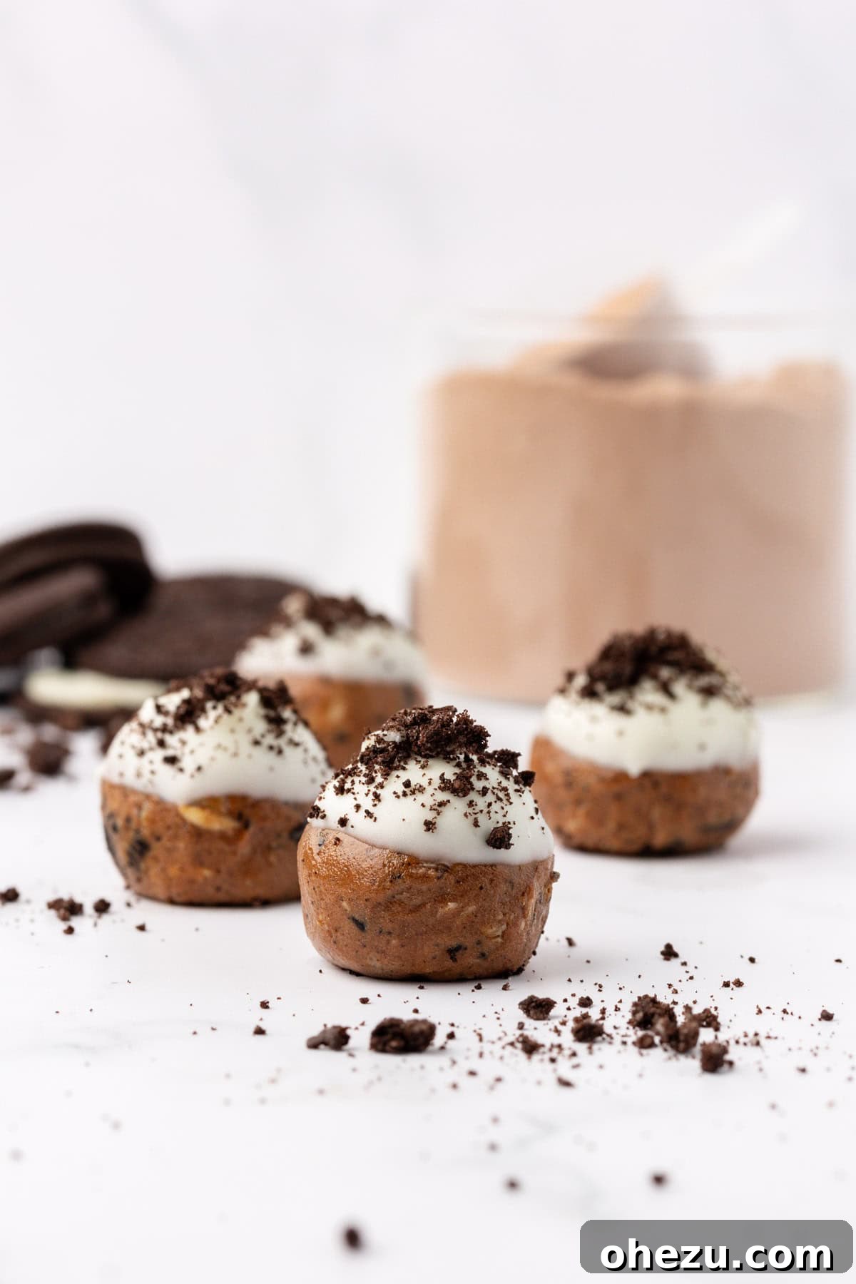Mixing bowl with protein ball batter, showing chopped Oreos folded in.