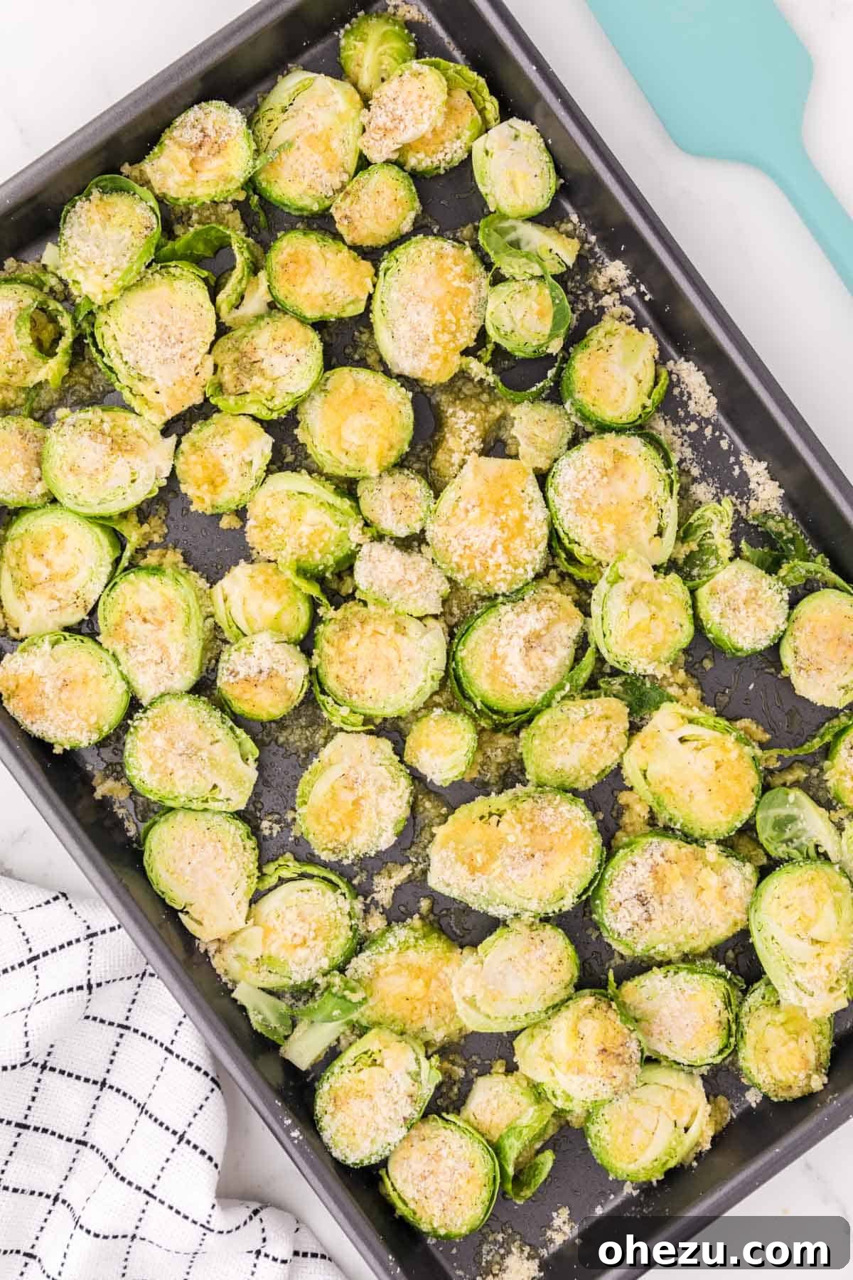 Savory Sprout Crisps 9 brussels sprouts coated in parmesan and spices, ready to bake