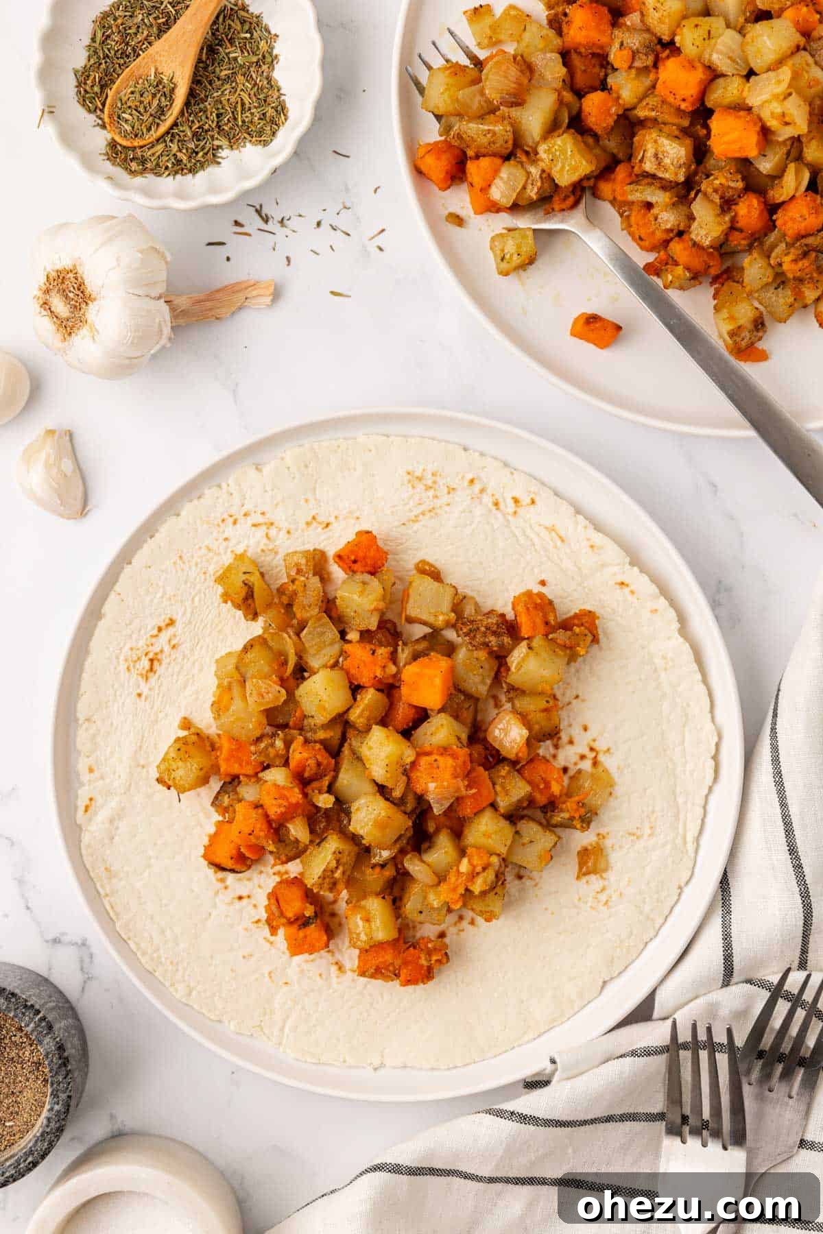 Plant-Powered Breakfast Hash 11 Vegan breakfast hash served on a warm tortilla, perfect for a breakfast burrito.