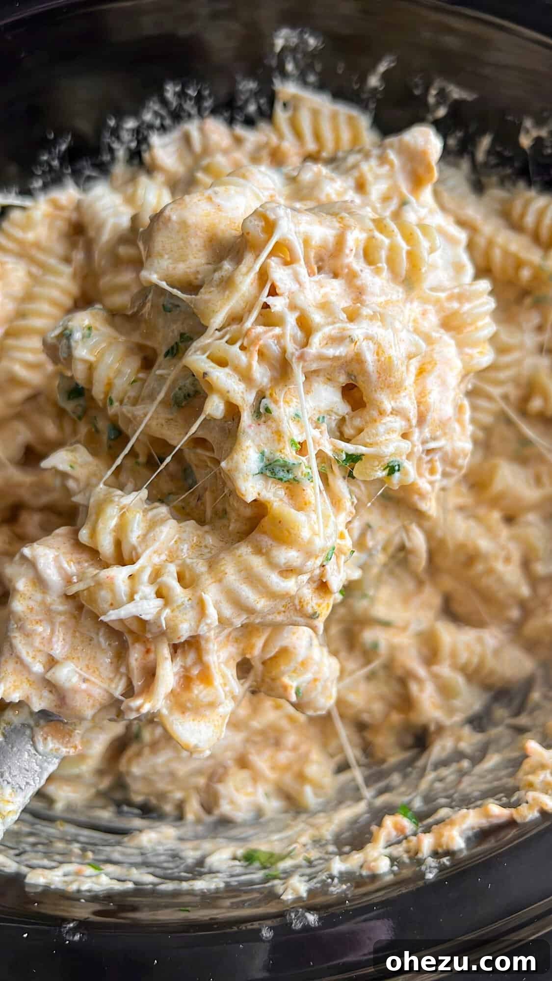 Viral Slow Cooker Chicken Pasta with Olive Garden Dressing 2 Creamy slow cooker chicken pasta with Olive Garden dressing, served in a bowl