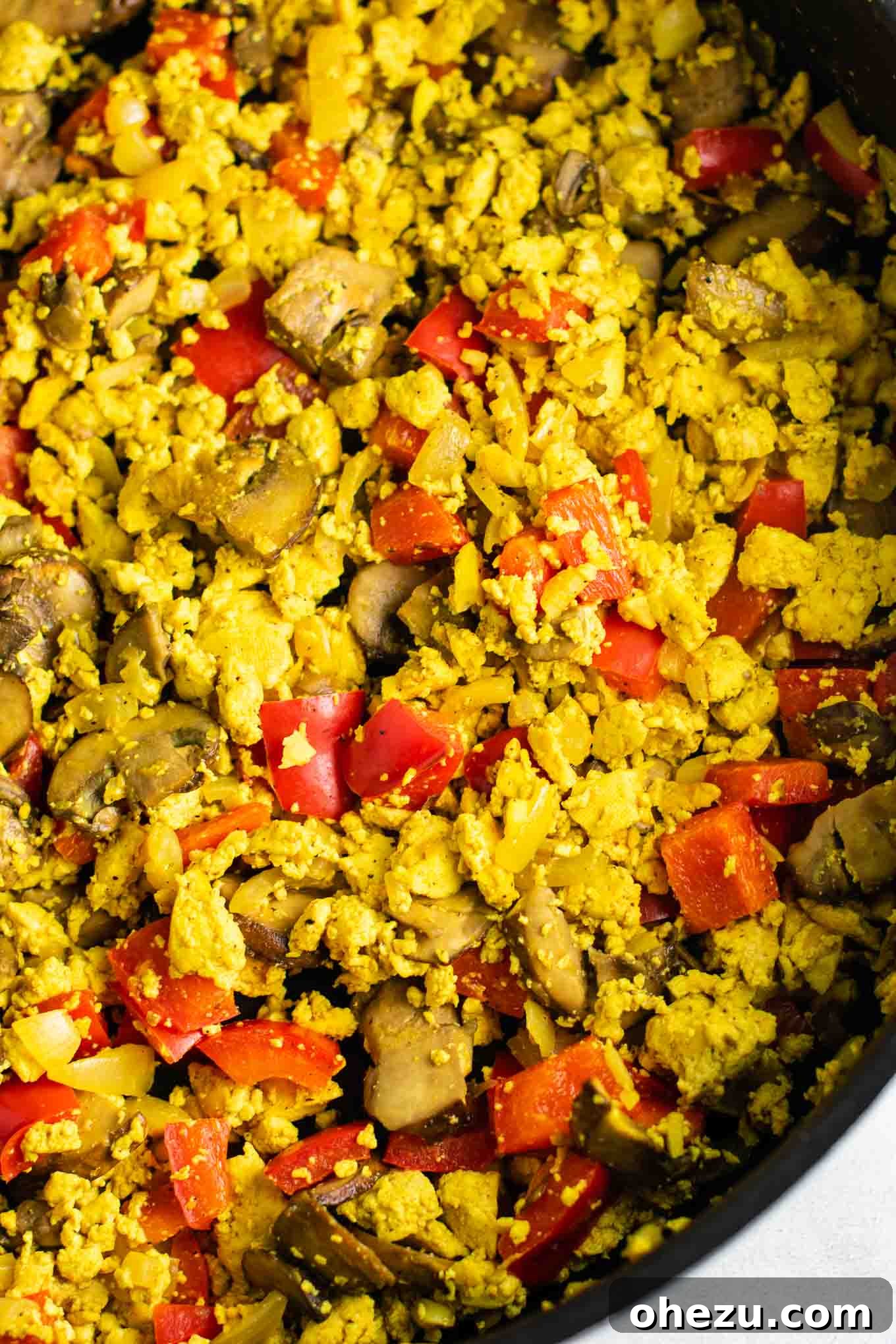 Close-up of how to make tofu scramble, highlighting texture. A delicious #vegan #breakfast with #tofu.