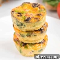 Stacked egg muffin cups, a perfect visual representation for a healthy, make-ahead breakfast.