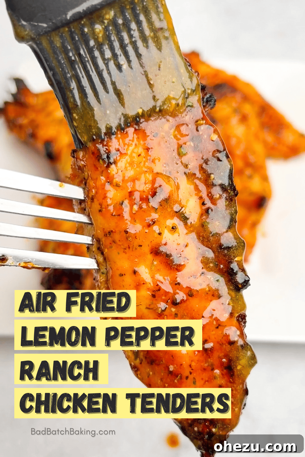 Air-Fried Hot Lemon Pepper Ranch Chicken Tenders 10 A well-composed photo of multiple air fried chicken tenders on a plate, ready to be served as a meal or appetizer.