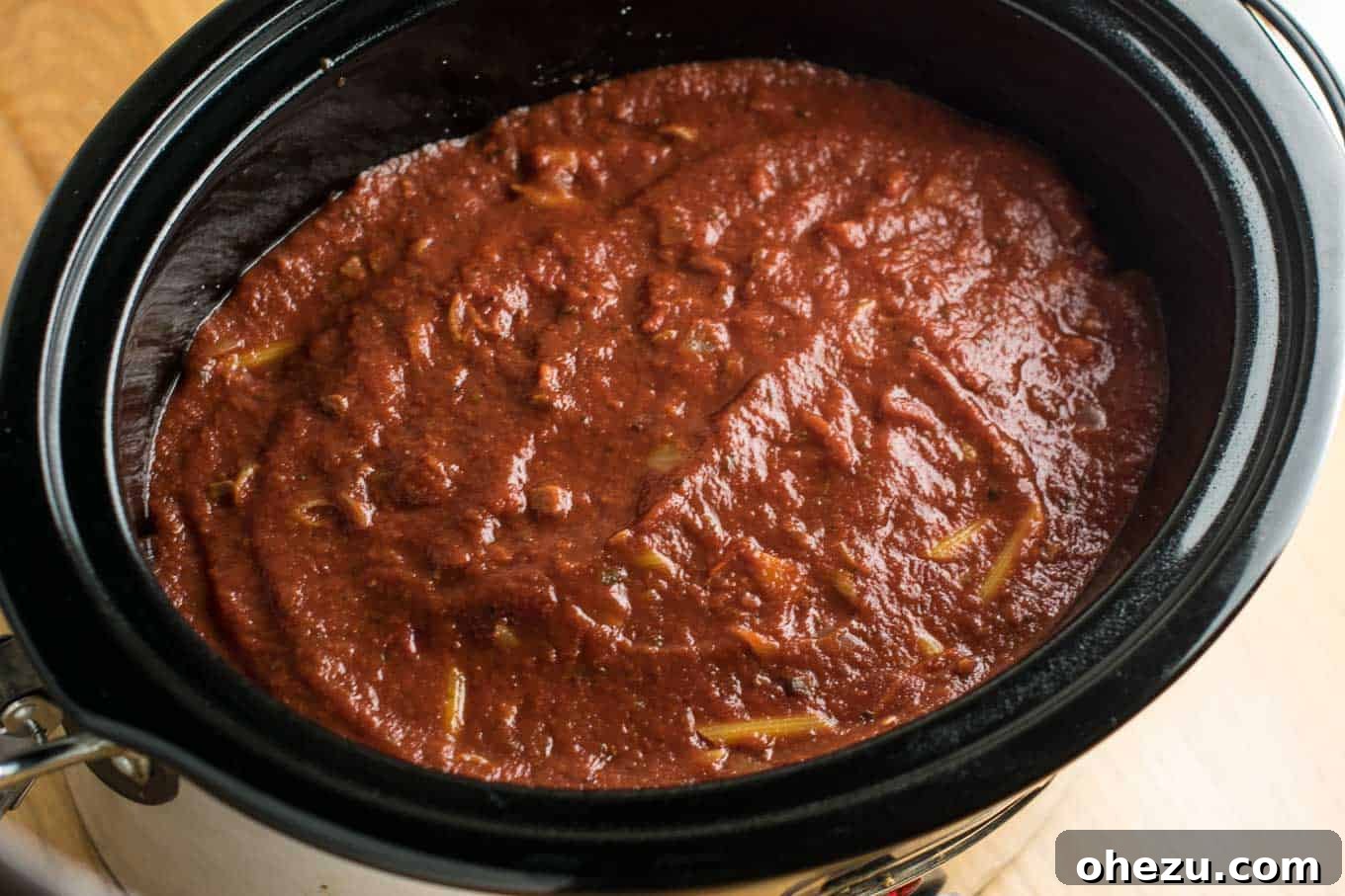This Easy Crockpot Baked Ziti gets RAVE reviews. Everyone loves this when I make it! So simple to assemble and you don’t even have to cook the noodles first! #crockpotbakedziti #ziti #pasta #slowcooker