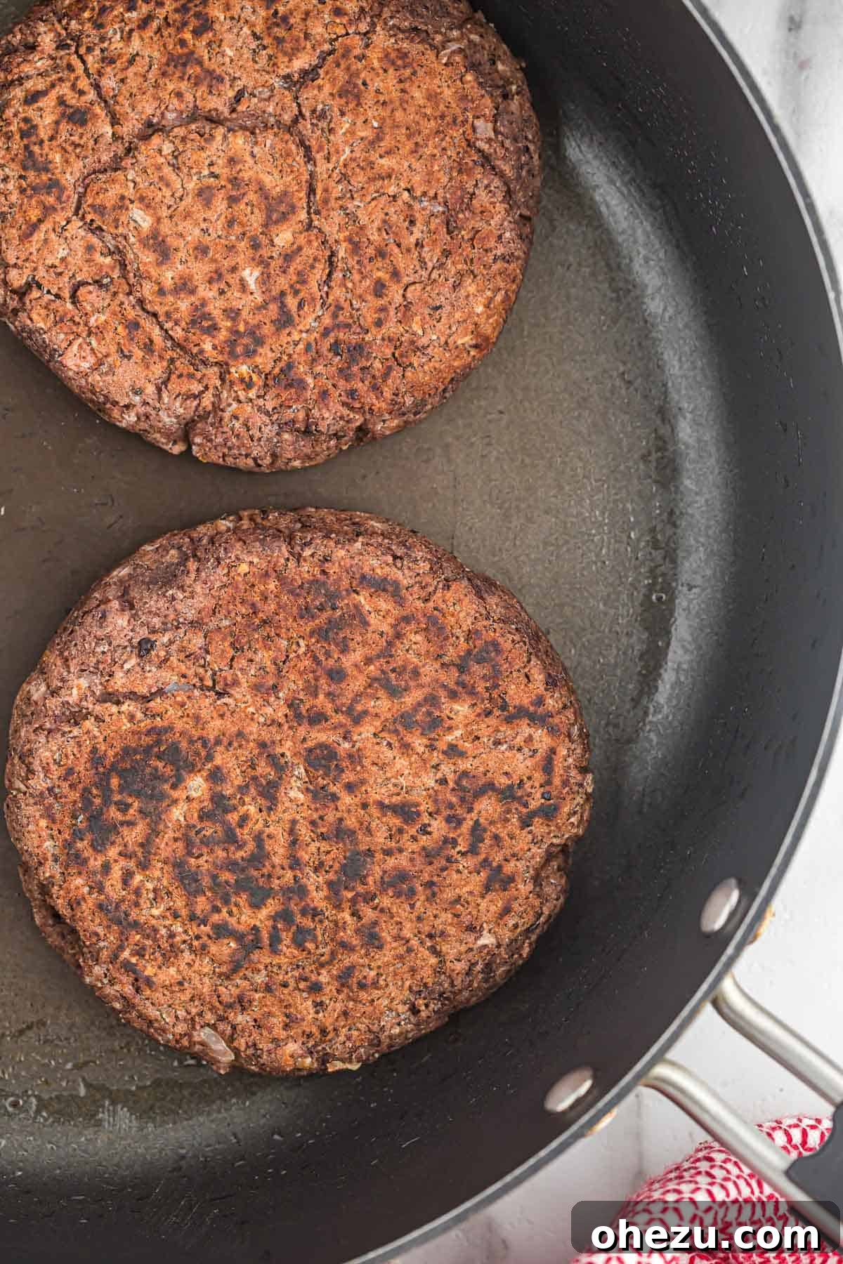 Freshly cooked black bean burgers with a crispy, golden-brown exterior.