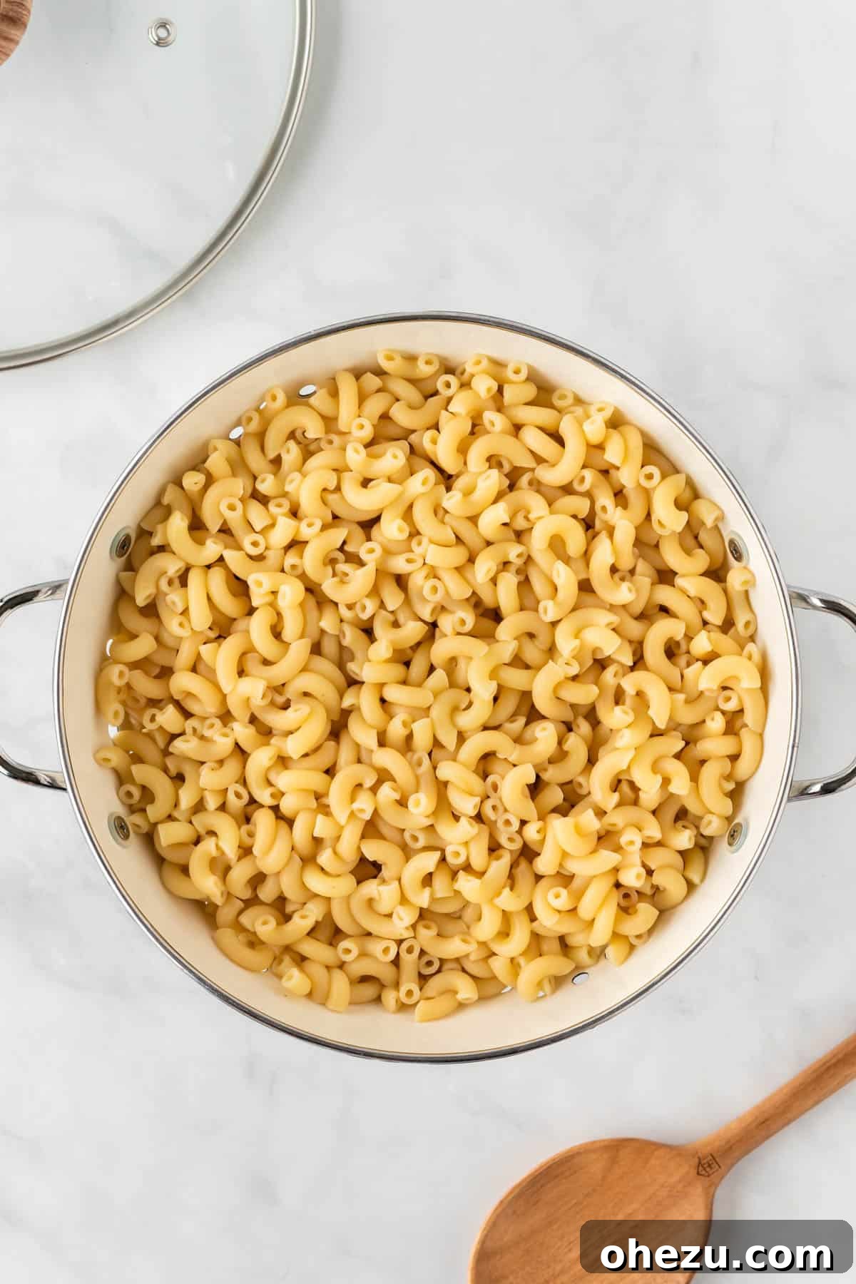 cooked macaroni noodles in a strainer