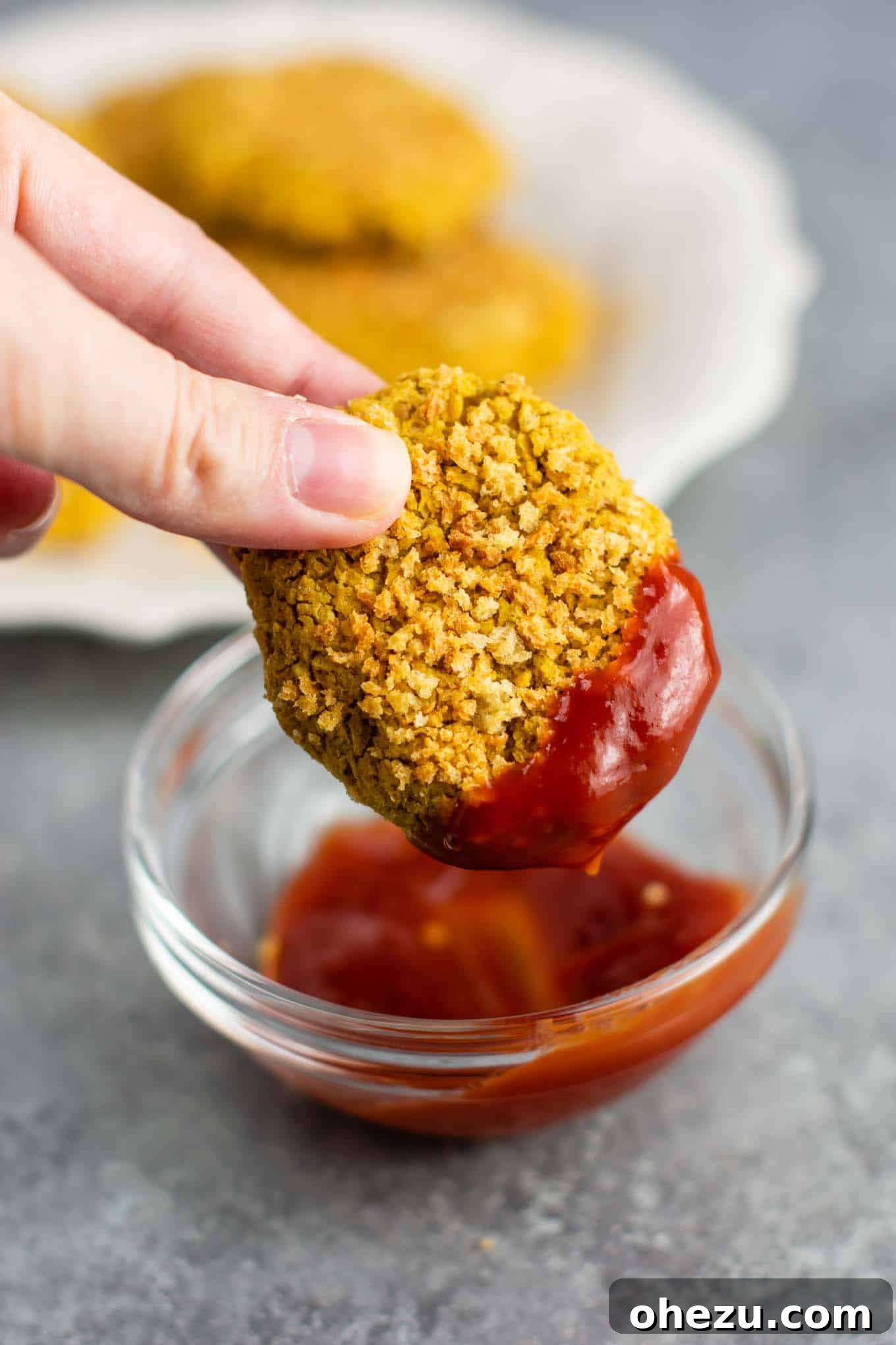 Golden Chickpea Bites 2 Crispy golden-brown chickpea nuggets on a baking sheet, ready to be served as a delicious meatless chicken nugget alternative.