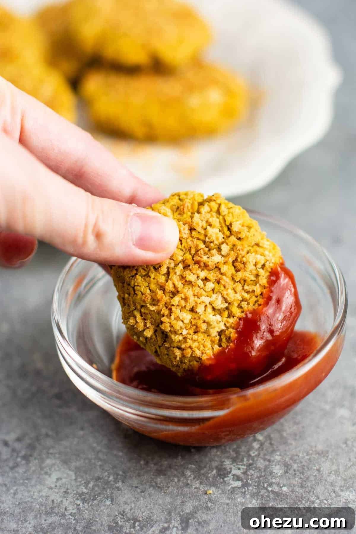 Golden Chickpea Bites 6 Platter of freshly baked vegetarian chickpea nuggets, golden and crispy, garnished for serving.
