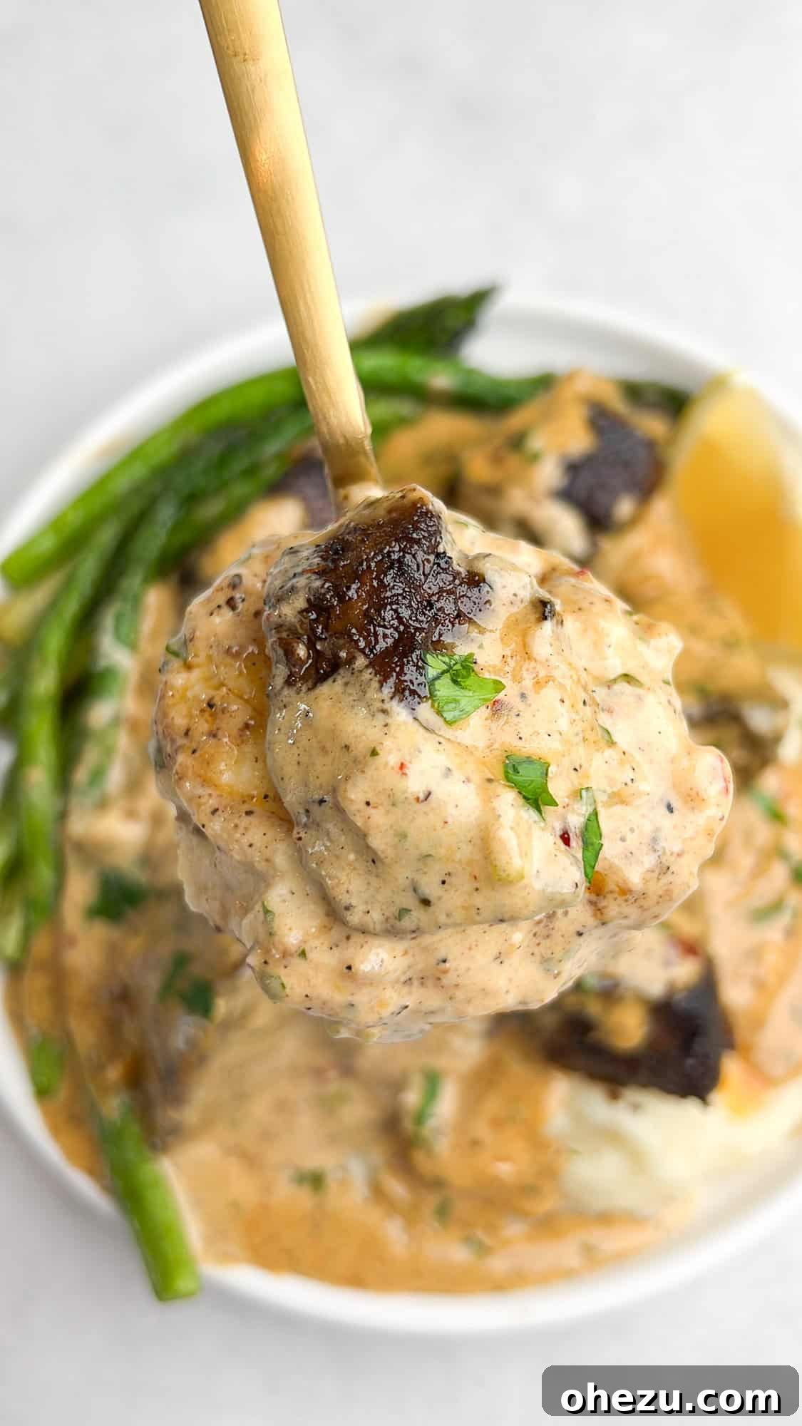 Plating Garlic Butter Steak Bites with mashed potatoes