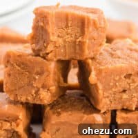A square of vegan peanut butter fudge with a bite taken out.