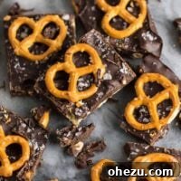 Vegan chocolate sea salt pretzel bark with visible pretzel pieces and flaky sea salt.