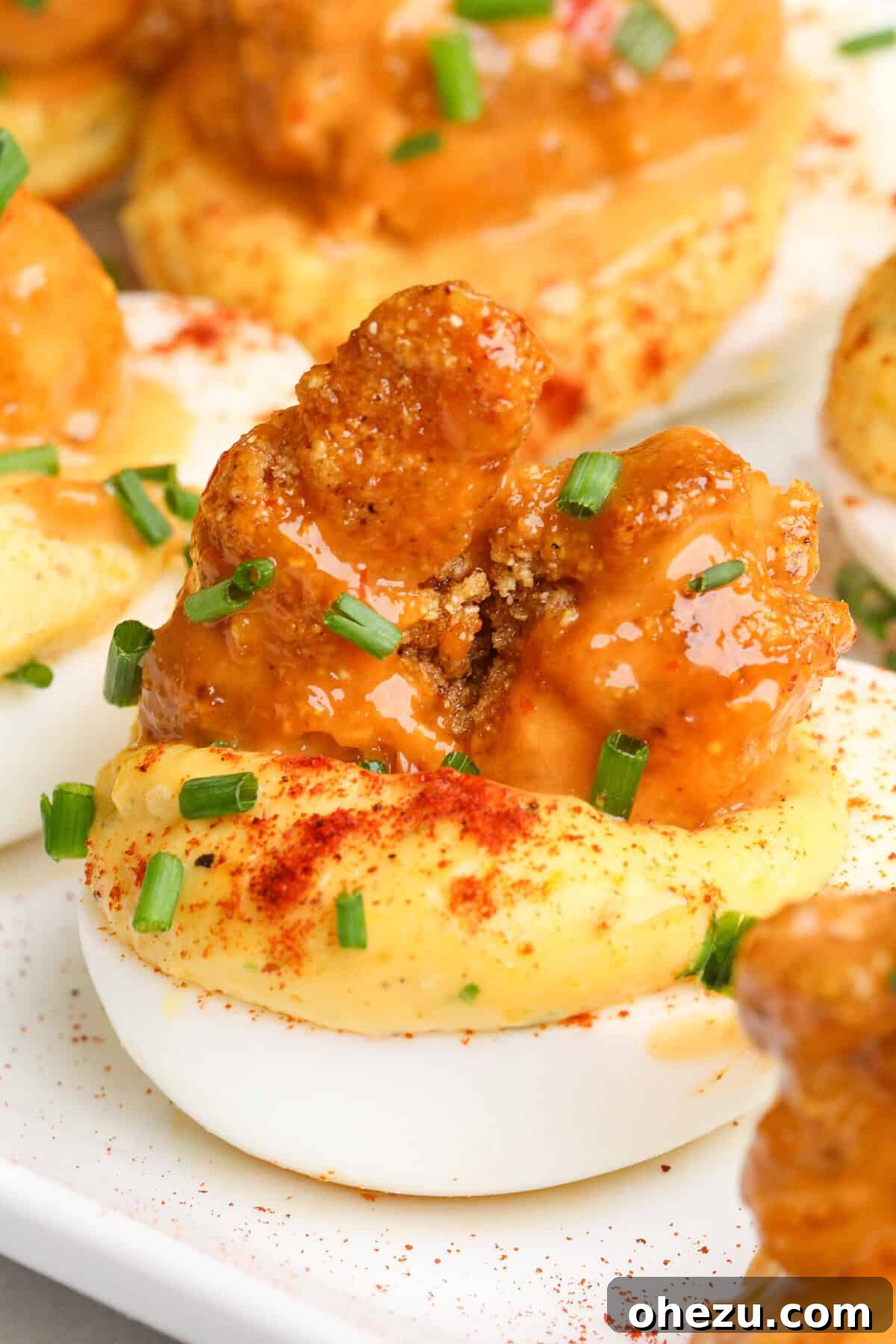 Dynamite Cajun Shrimp Deviled Eggs 4 Ingredients laid out for Firecracker Shrimp Deviled Eggs, including fresh shrimp, eggs, and various condiments
