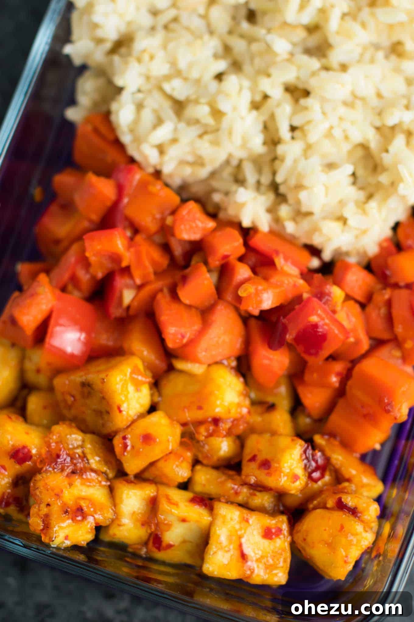 Flavorful Vegan Dinner Creations 17 Meal prep friendly Sweet Chili Tofu Bowls with brown rice and mixed vegetables, a delicious vegan and vegetarian meal option. #vegan #vegetarian #veganmealprep #tofu