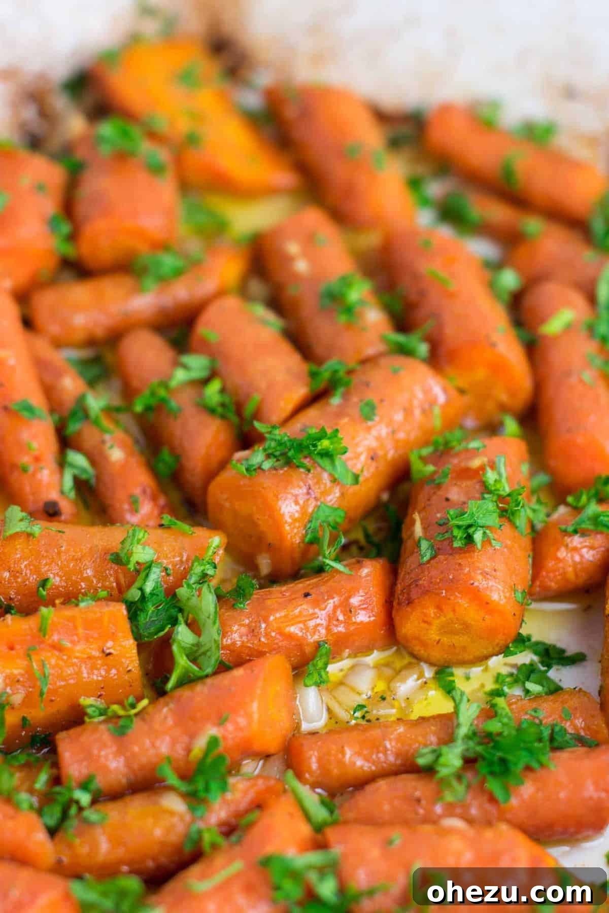 Flavorful Vegan Dinner Creations 25 Irresistible garlic butter roasted carrots with fresh parsley, an easy and delicious vegan-friendly side dish that disappears quickly. #vegan #roastedcarrots #garlicbutter #garlicbuttercarrots #sidedishes #vegetables