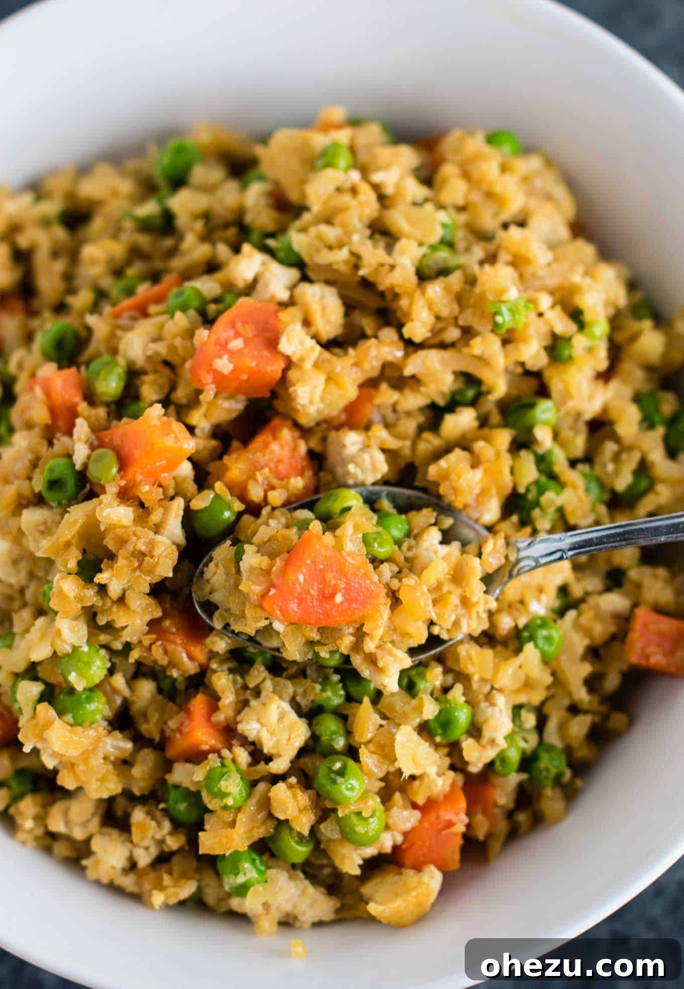 Flavorful Vegan Dinner Creations 9 Healthy and delicious cauliflower tofu fried rice, vegan, gluten-free, grain-free, and low carb, offering an amazing eggless and riceless dinner option. #grainfree #glutenfree #cauliflowerfriedrice #tofufriedrice #vegan #dinner #eggfree