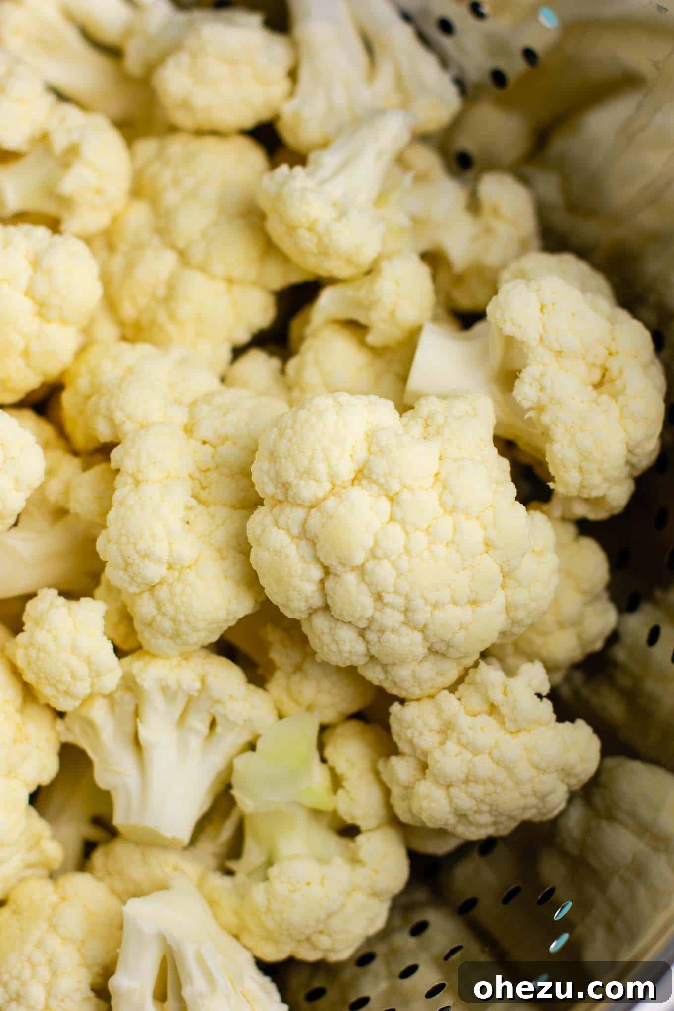 Close-up of raw cauliflower florets neatly cut and ready for steaming