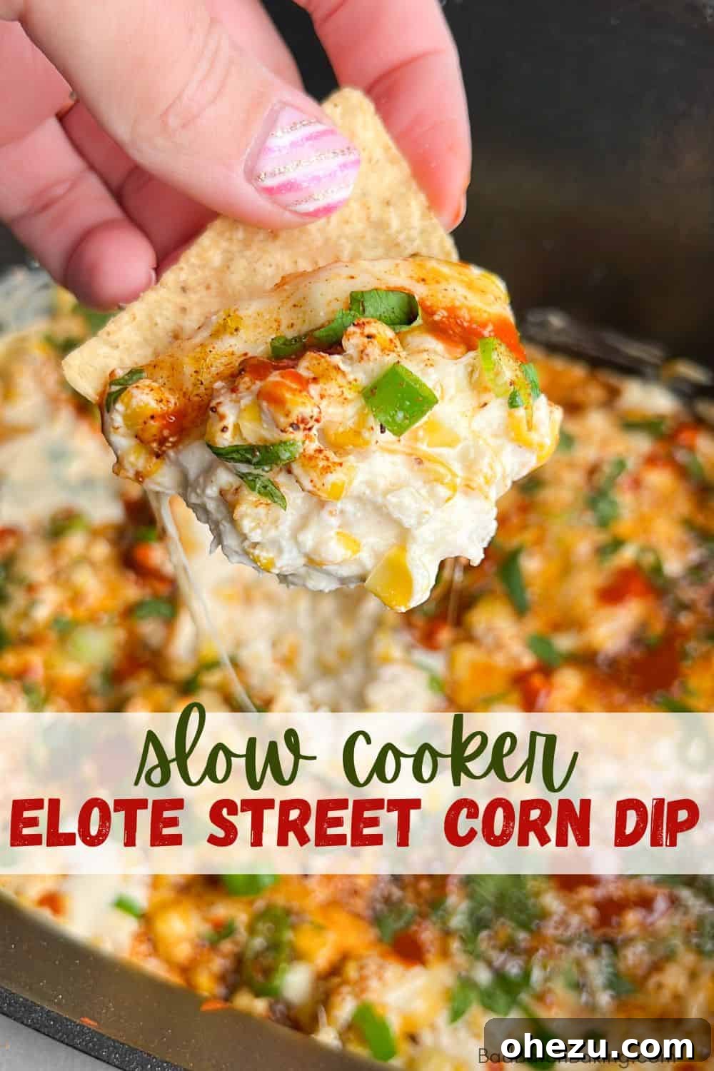 Warm Fiesta Corn Dip 8 Mexican street corn dip in a white bowl with a spoon