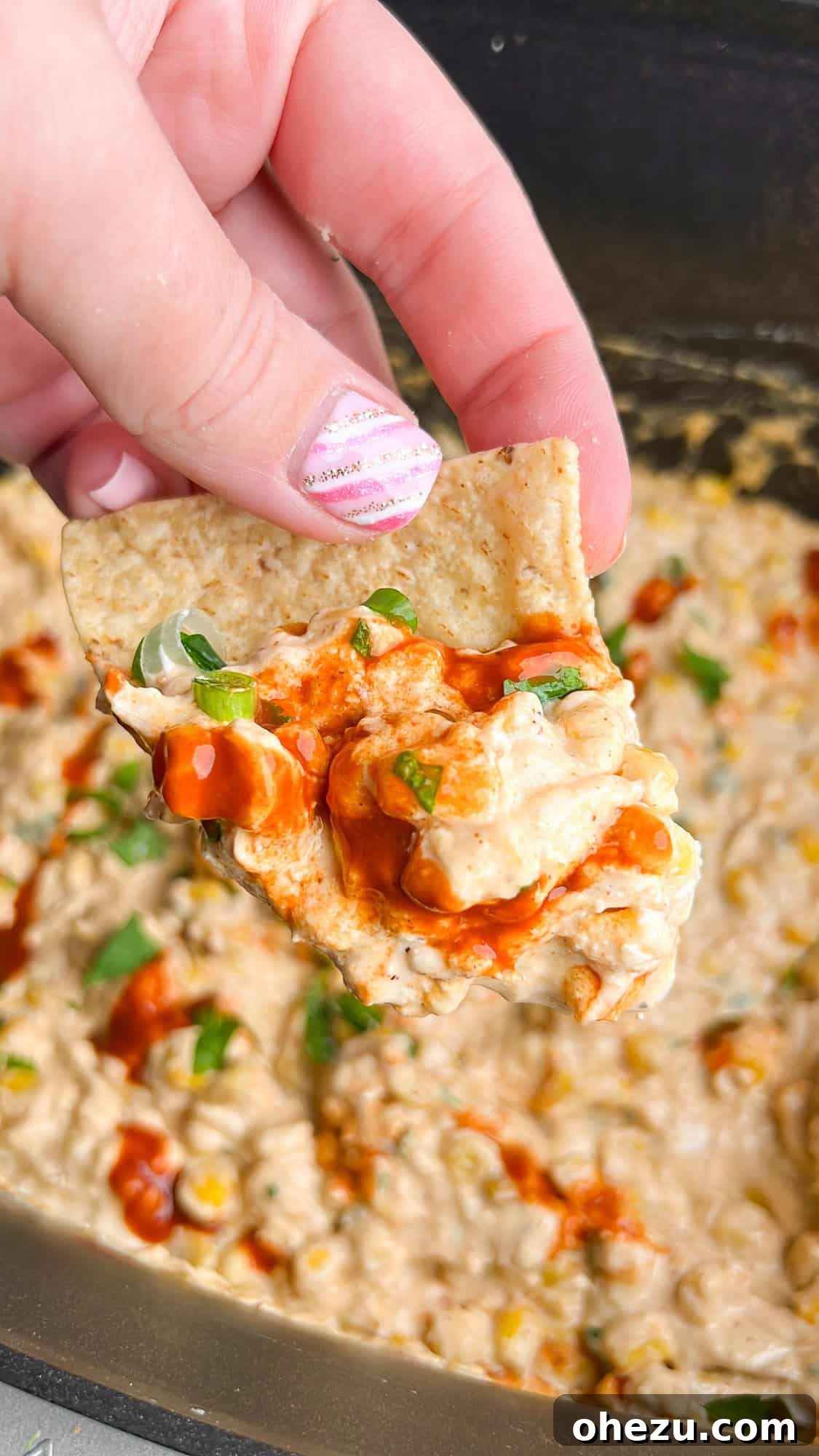 Warm Fiesta Corn Dip 4 Mexican street corn dip in a bowl with tortilla chips