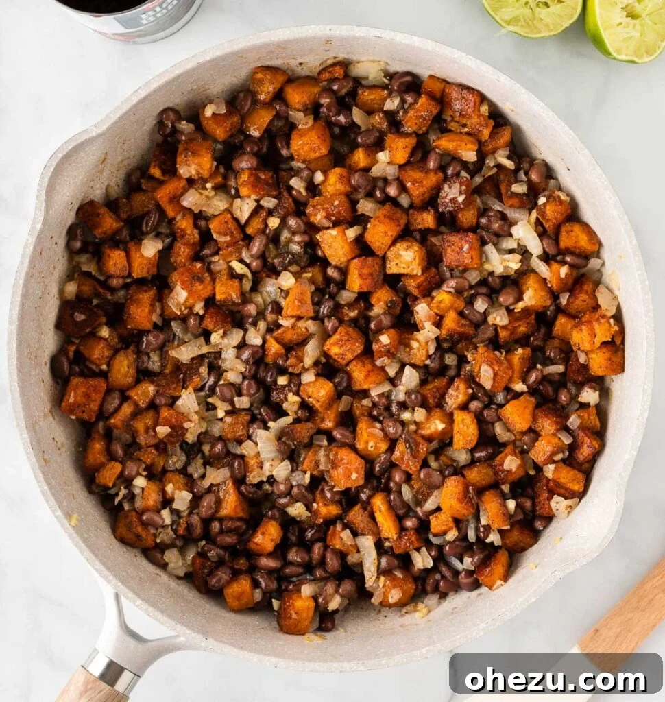 The finished sweet potato black bean taco filling, rich and vibrant, ready for serving