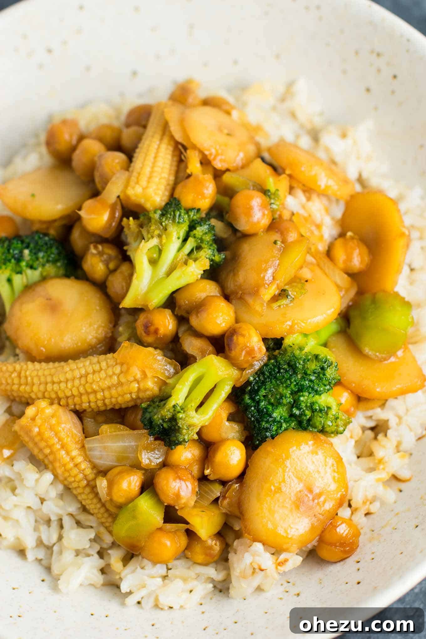 Plant-Powered Chickpea Stir-Fry 2 This easy vegan chickpea stirfry bowl with brown rice will be a hit with the whole family! #vegan #veganstirfry #chickpeastirfry #vegandinner