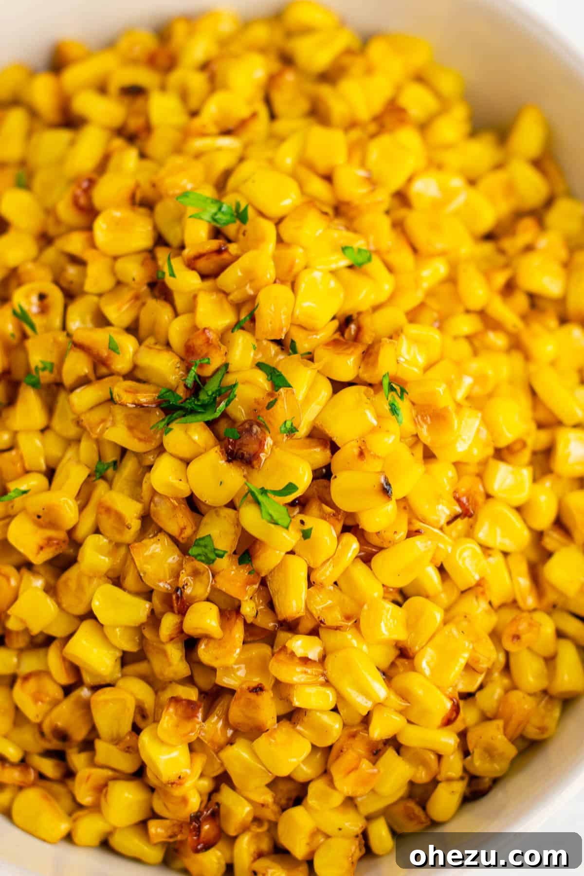 Sizzling Skillet Corn 6 golden skillet corn topped with fresh parsley