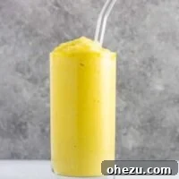 Pineapple detox smoothie with cucumbers, celery, lemon, peaches, ginger, and frozen bananas. A healthy smoothie recipe that tastes delicious! #detox #detoxsmoothie #healthysmoothie #vegan #healthyeating #healthyrecipe #smoothie #vegansmoothie