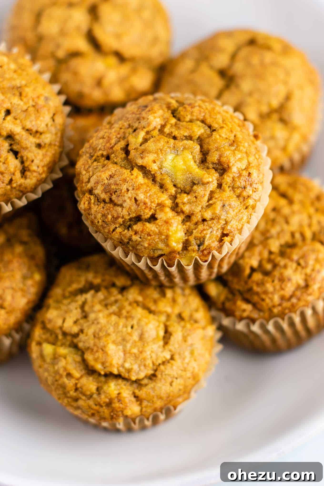 A stack of vegan breakfast muffins, highlighting their soft texture and appealing appearance, ready for a healthy start to the day.