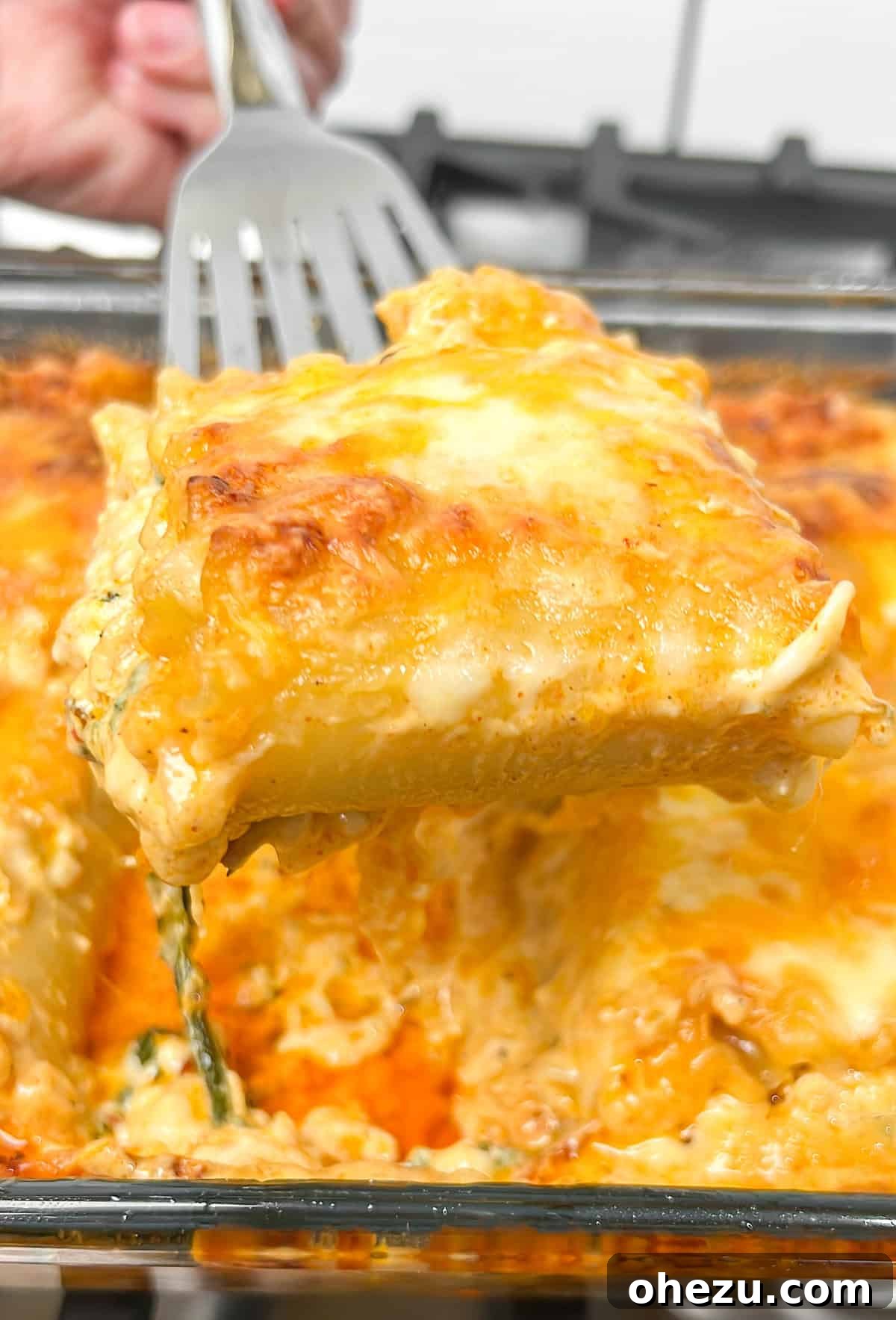 A perfectly portioned Cajun Chicken Lasagna Roll-up on a white plate