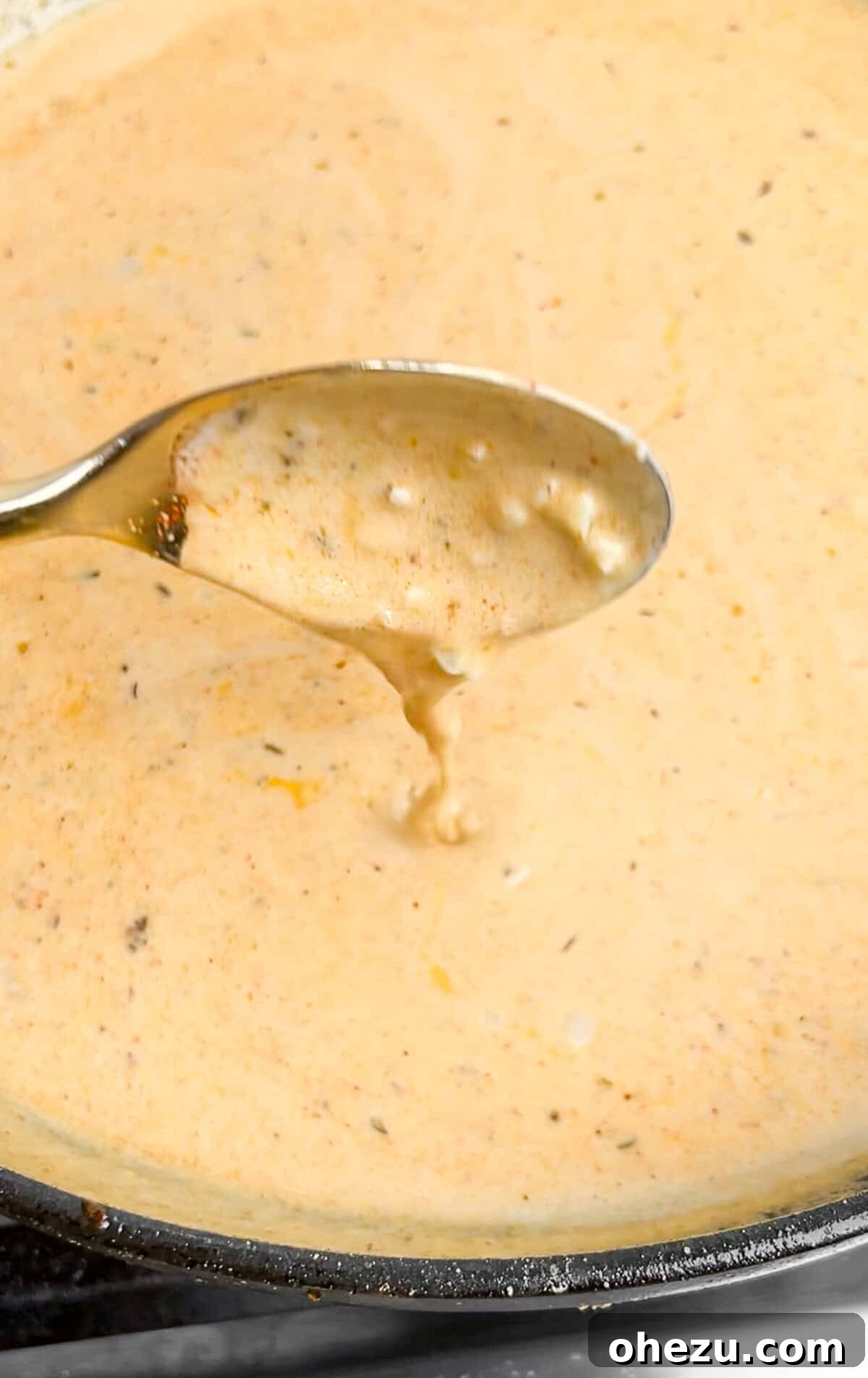 Sautéing garlic and making the Cajun Alfredo sauce