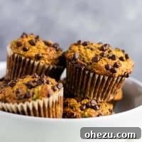Healthy zucchini chocolate chip muffins made with easy ingredients. Perfect for using up all of that summer zucchini!