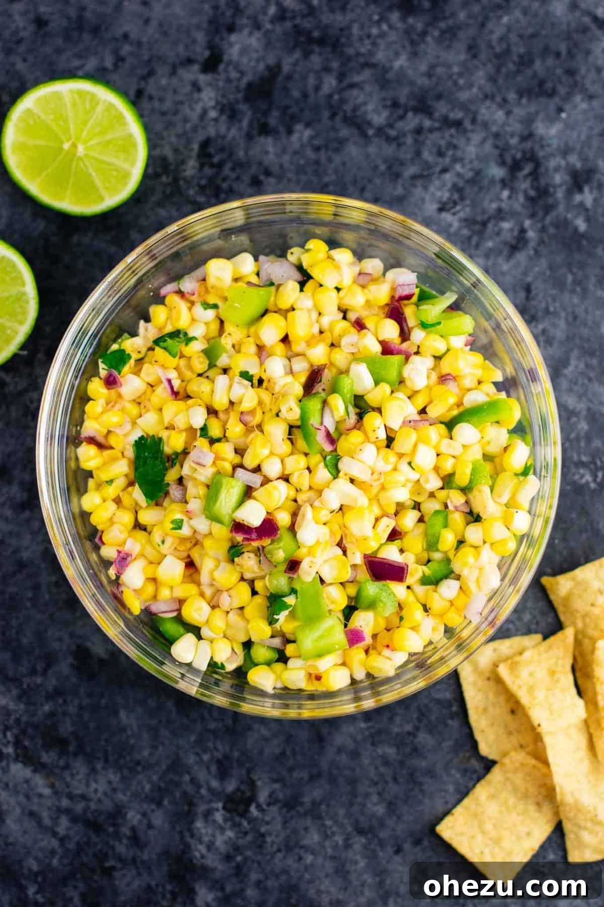 A large bowl of delicious fresh corn salsa, perfect for sharing or a party appetizer.