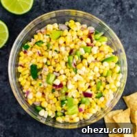 The best easy fresh corn salsa recipe made with just a few ingredients. It tastes better than chipotle and is ready in minutes! Make your own burrito bowls at home with this awesome corn salsa. #chipotlecornsalsa #cornsalsa #chipotle #burritobowl #appetizer #vegan #corn #appetizer