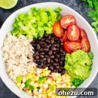 Vegan burrito bowl recipe with homemade fresh corn salsa and guacamole. Better than chipotle and so fresh and delicious!
