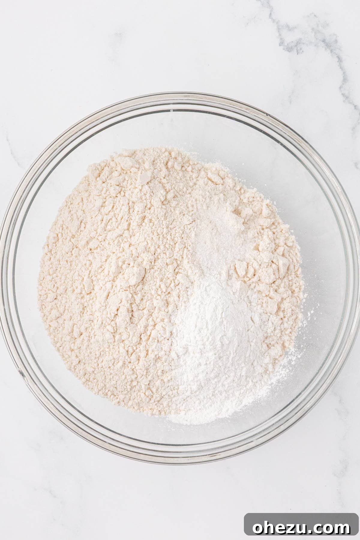 Dry ingredients (flour, baking powder, salt) in a mixing bowl before whisking.