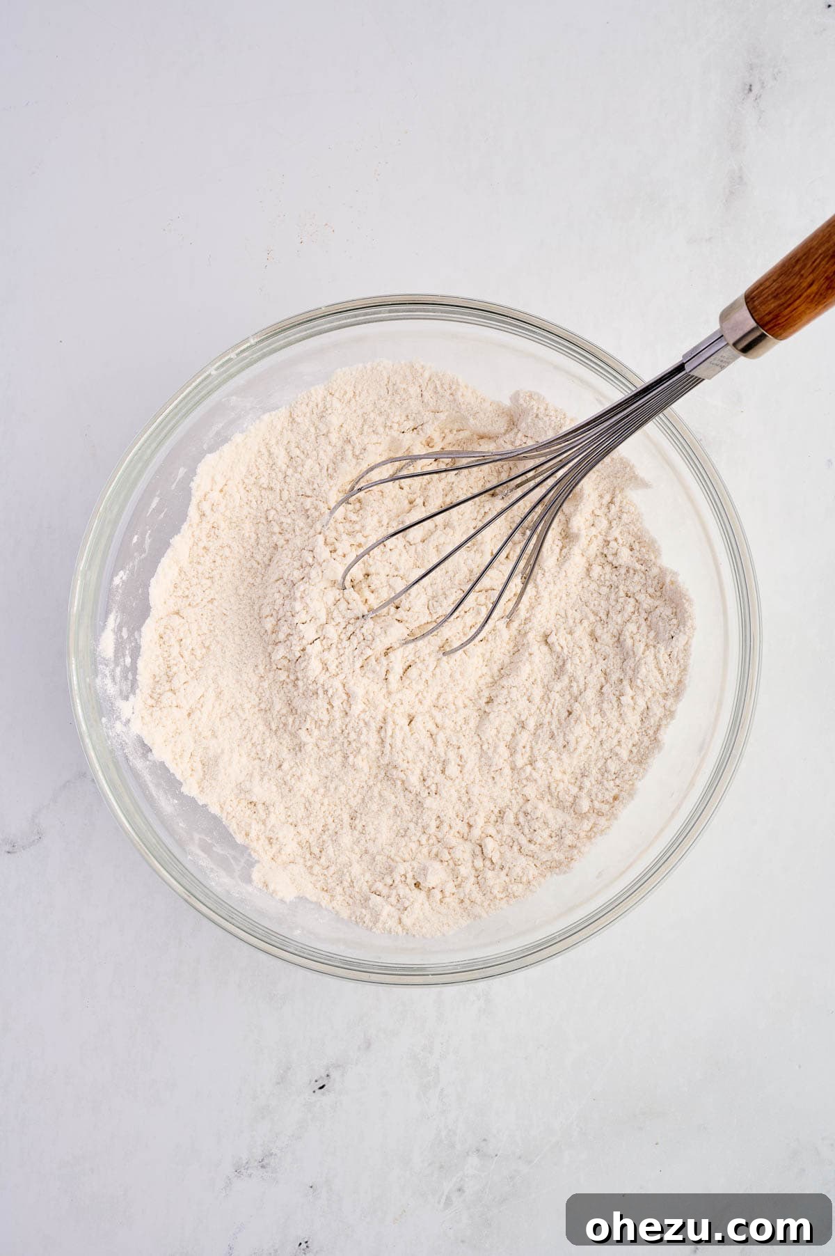 Moist Banana Greek Yogurt Muffins 6 Dry ingredients thoroughly whisked together in a bowl.