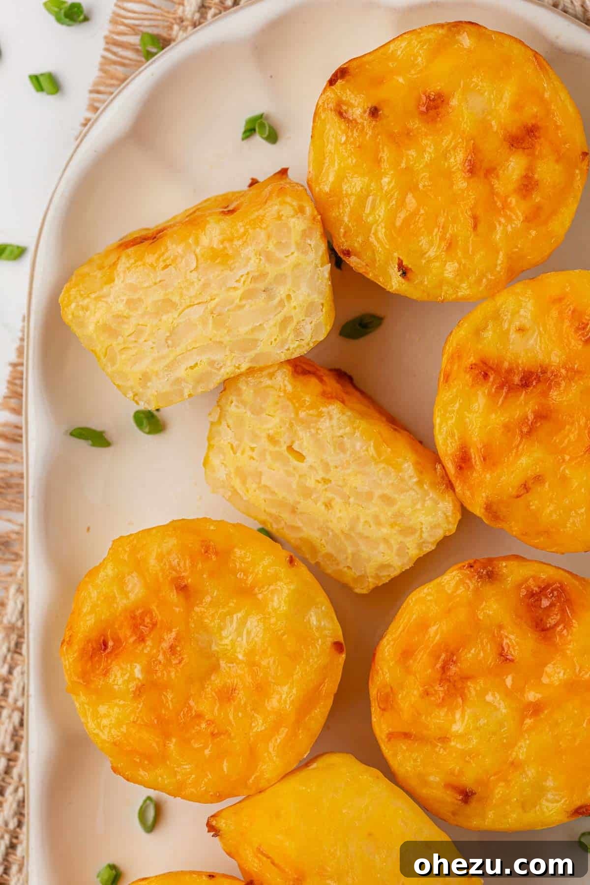 close-up of hash brown egg cups on a plate, showing the fluffy internal texture