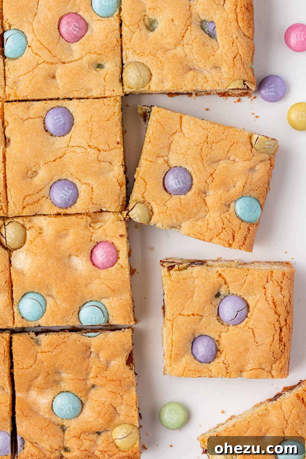 A freshly baked pan of Easter cookie bars, golden and studded with M&M's.