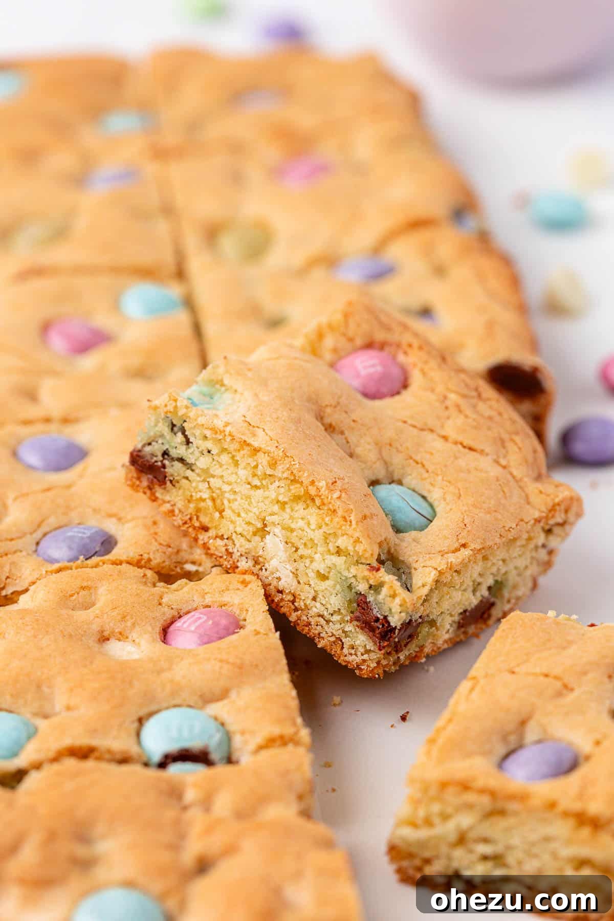 Close-up of Easter cookie bars adorned with colorful M&M's.